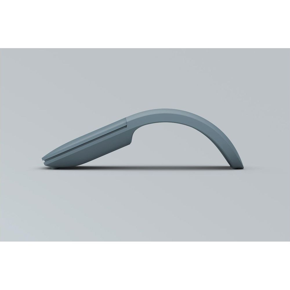 Un mouse grigio dal design minimalista, mostrato di lato.