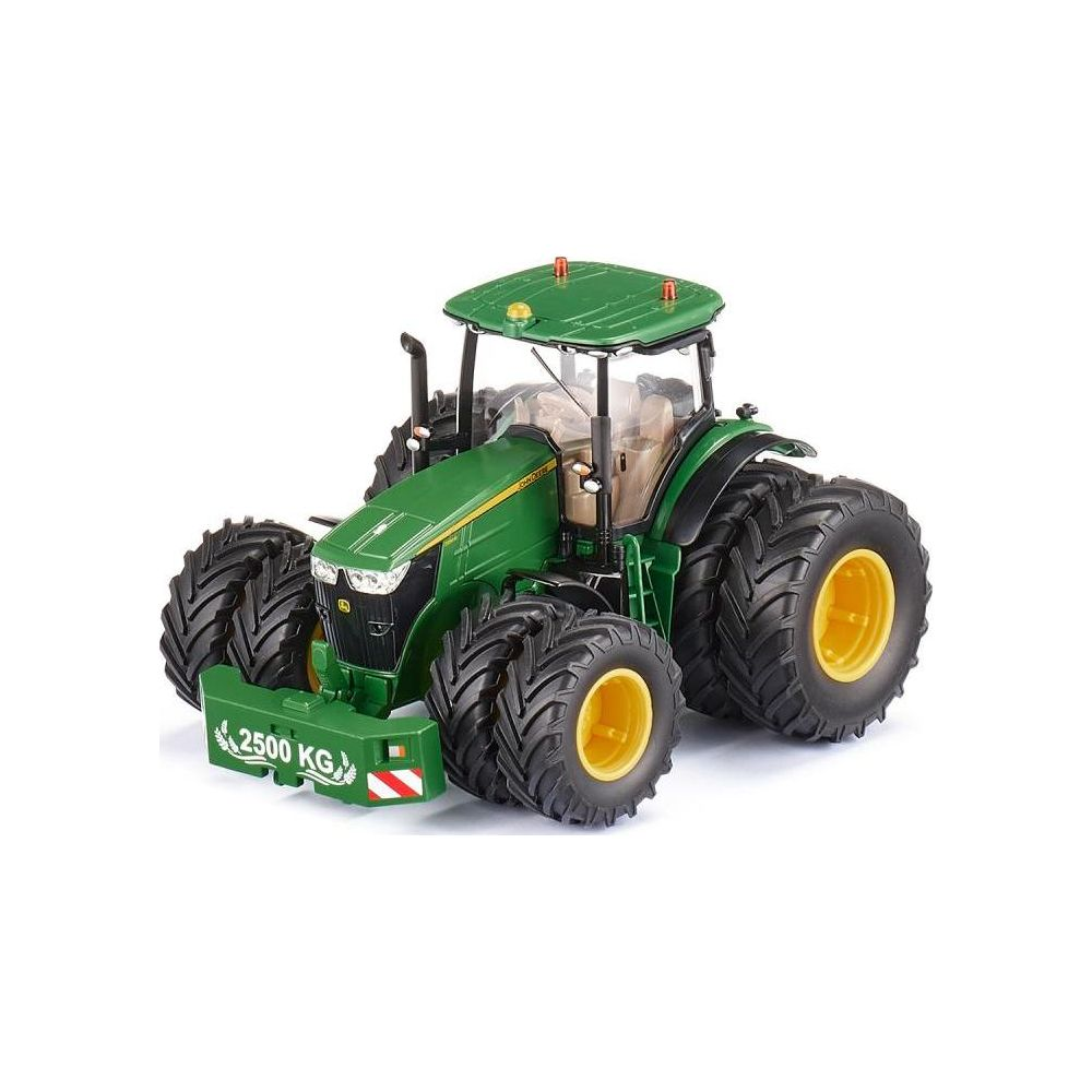 Un tractor de juguete verde con neumáticos grandes y llantas amarillas.