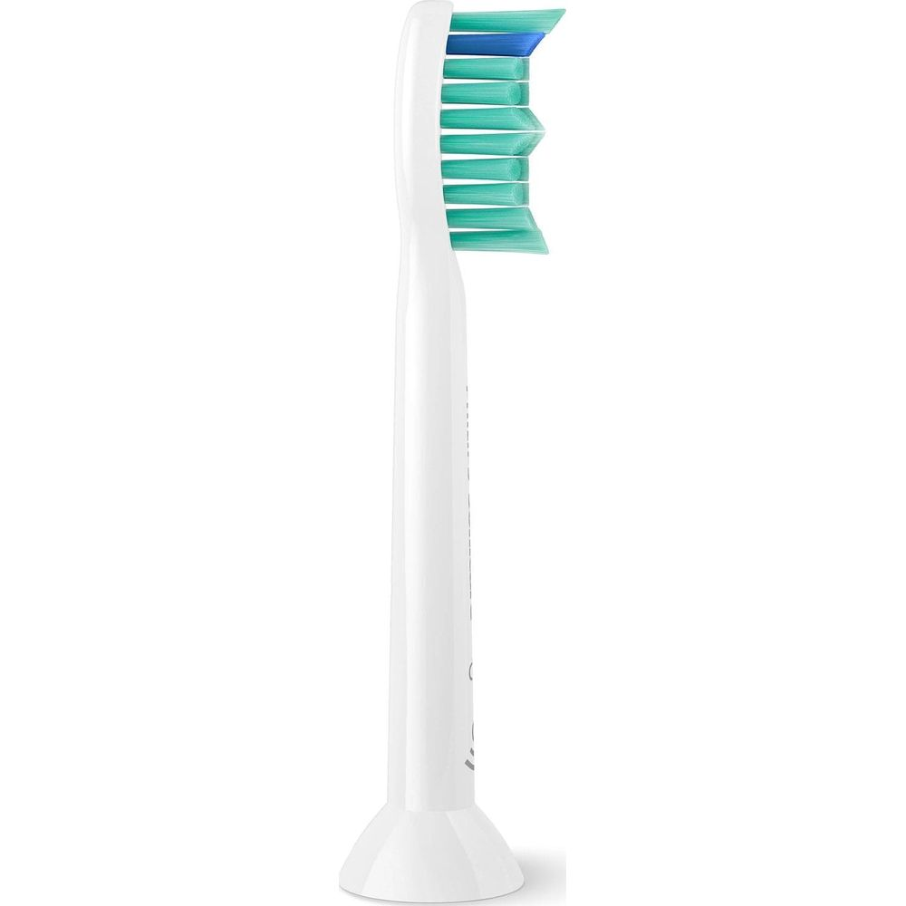 A white toothbrush head with green and blue bristles.