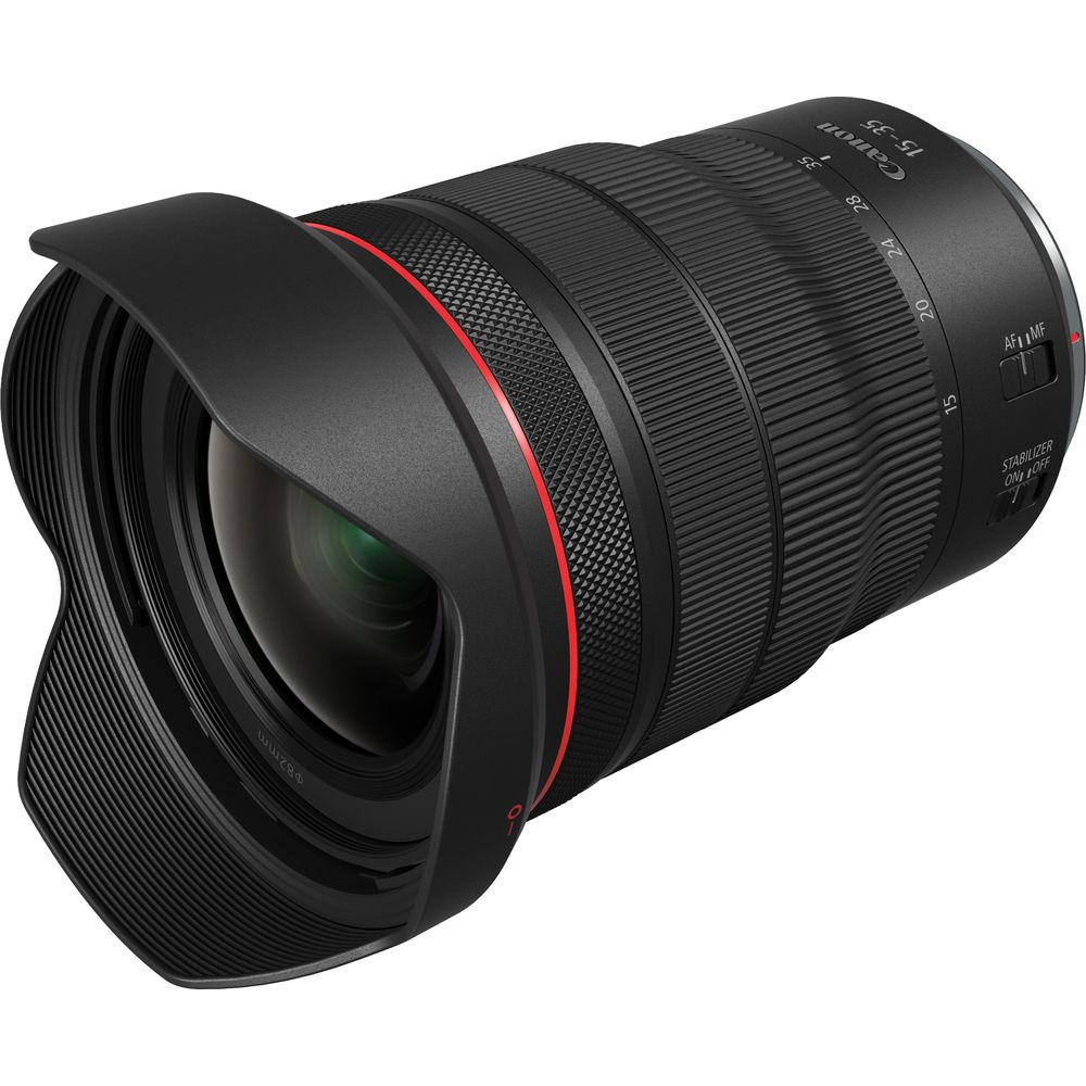 Un objectif d'appareil photo Canon noir avec un anneau rouge et un pare-soleil.