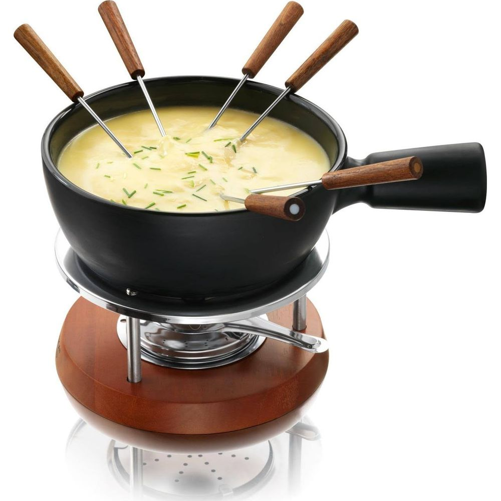 A cheese fondue pot with wooden handles on a wooden stand with a burner.