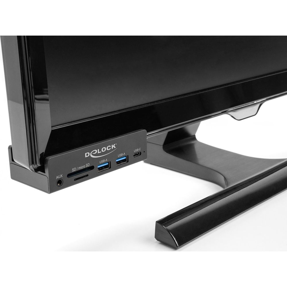 Monitor con pannello porte integrato: AUX, SD/micro SD, 2x USB-A, USB-C.