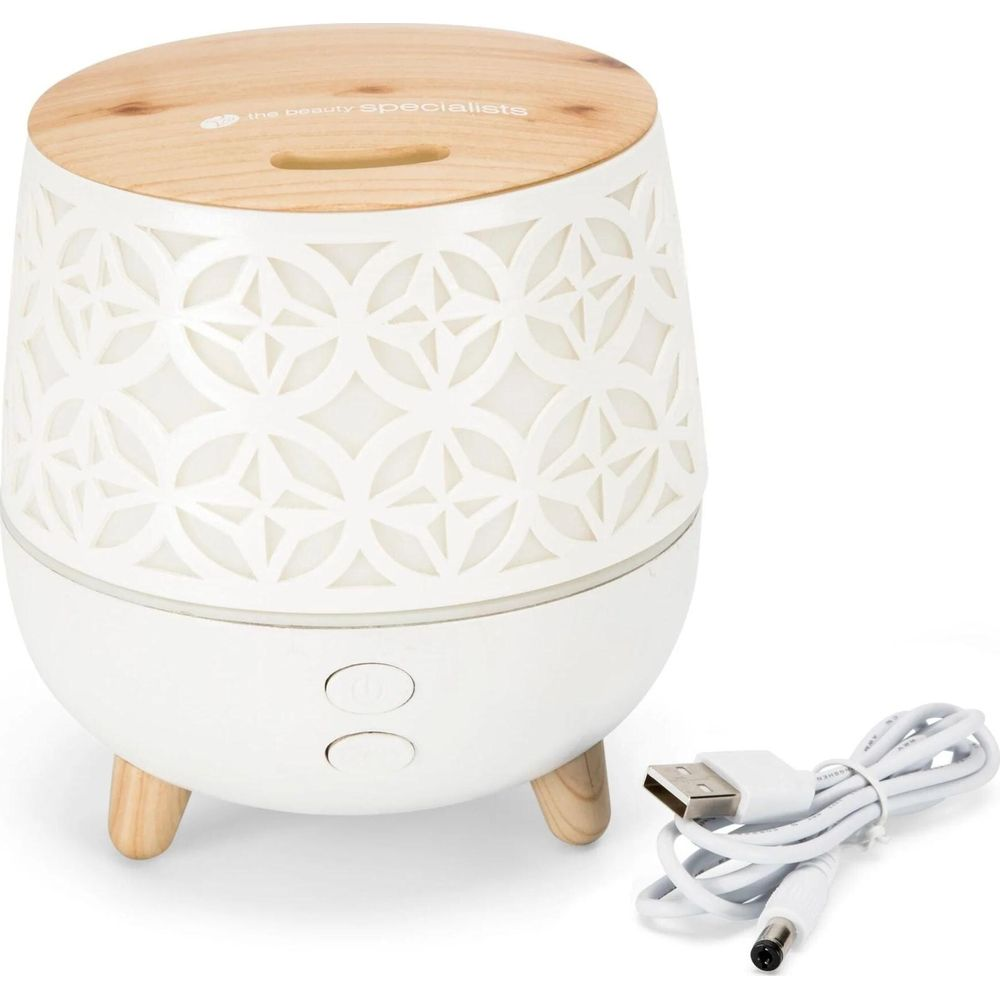 Un diffusore bianco con coperchio e gambe in legno, con cavo USB.