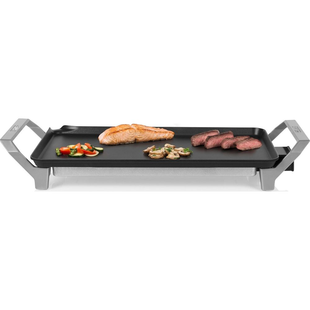 Ein Elektrogrill mit Lachs, Gemüse, Pilzen und Steak.