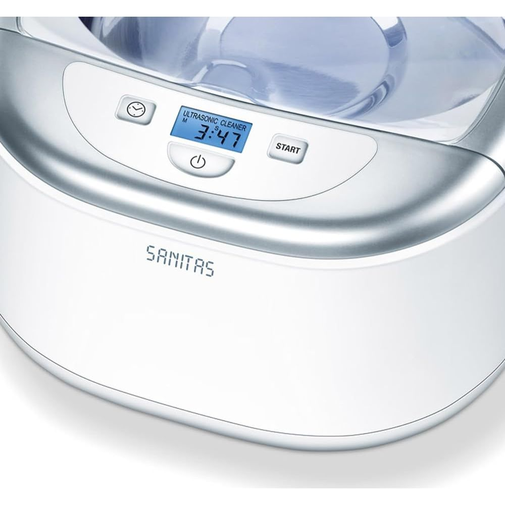 Ein weißer Ultraschallreiniger von Sanitas mit digitaler Anzeige und Startknopf.