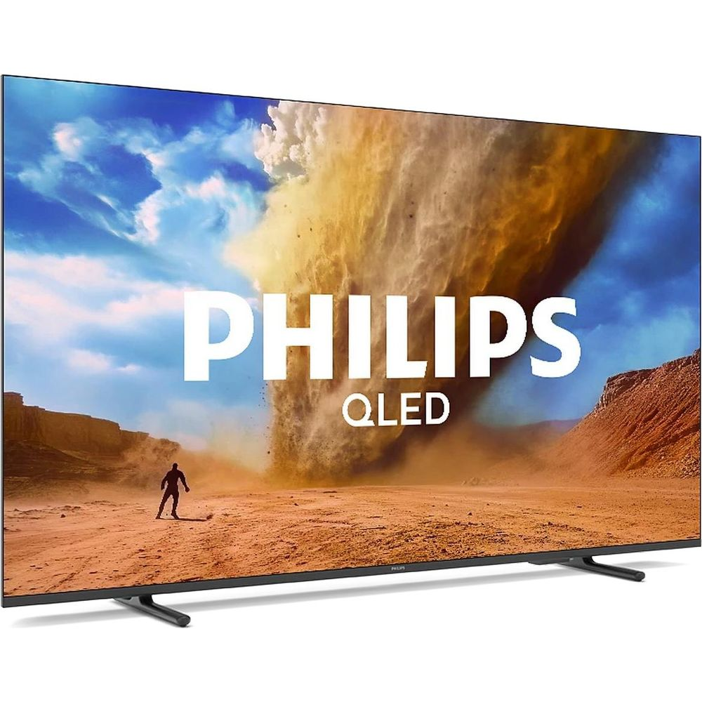 Telewizor Philips QLED wyświetla scenę burzy piaskowej z mężczyzną.