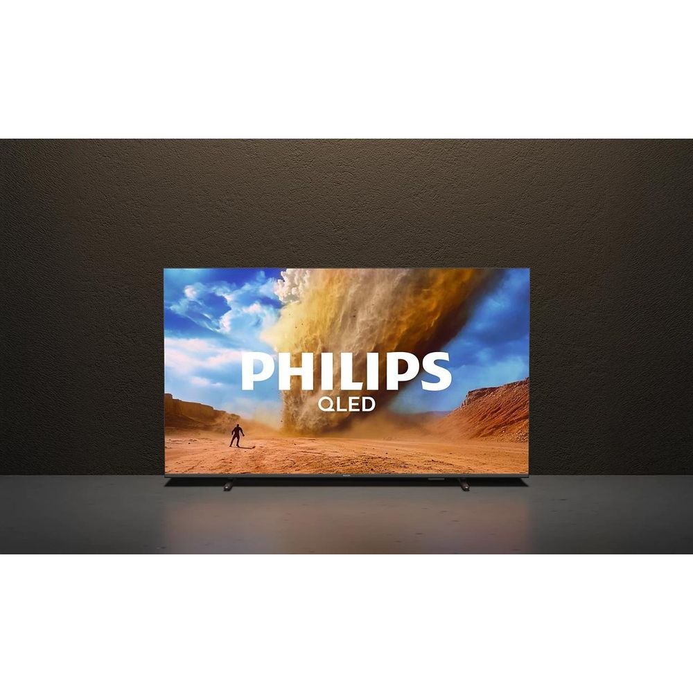 Telewizor wyświetla scenę z diabłem pyłowym z logo Philips QLED.