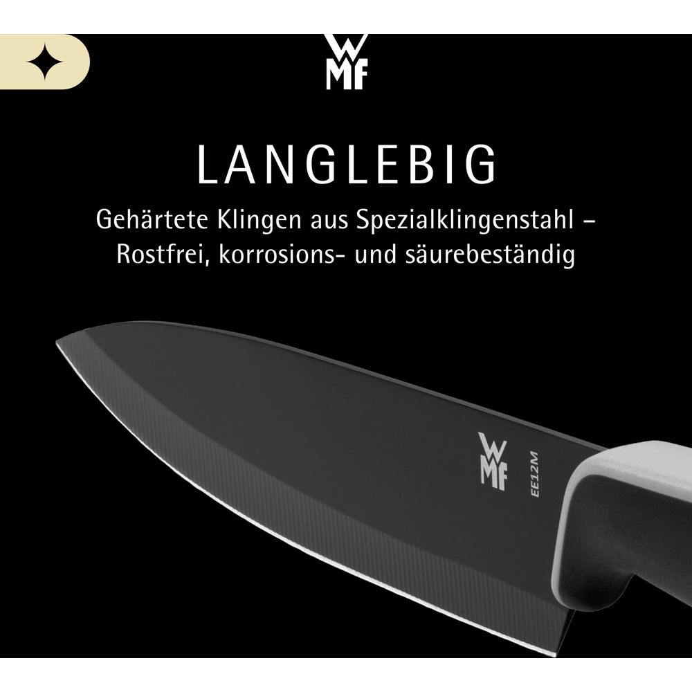 Zbliżenie czarnego ostrza noża z logo i tekstem WMF.