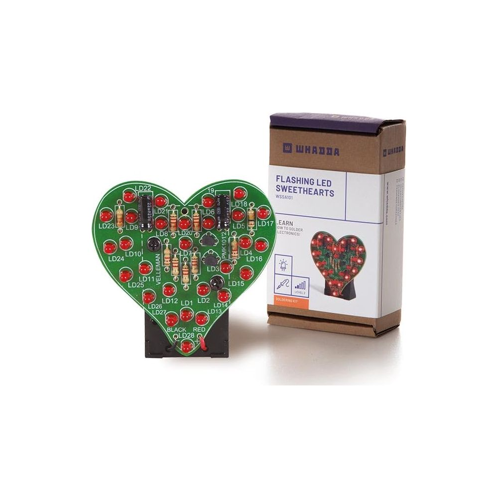Ein Herzförmiges Lötkit mit vielen LEDs und Widerständen daneben die Verpackung.