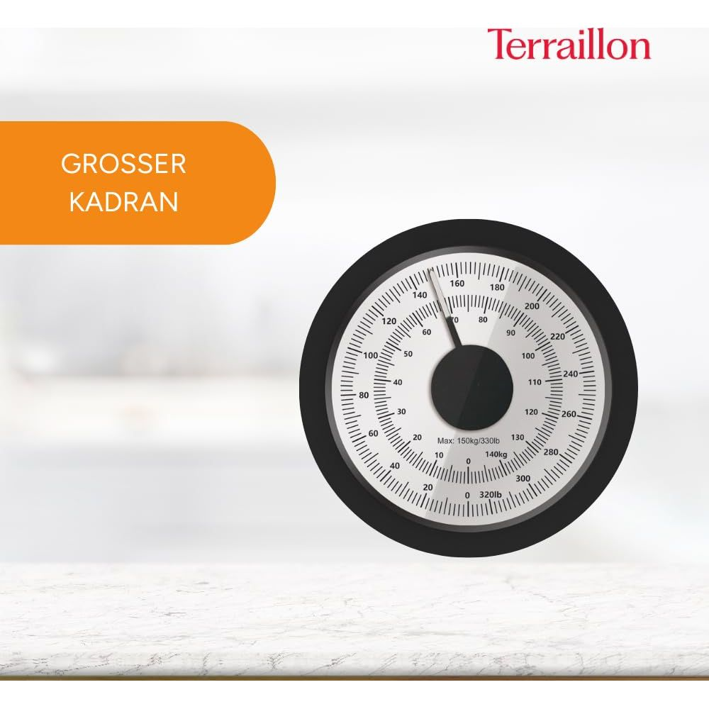 Biała waga z czarną tarczą i czerwoną wskazówką. Maks. 150 kg.