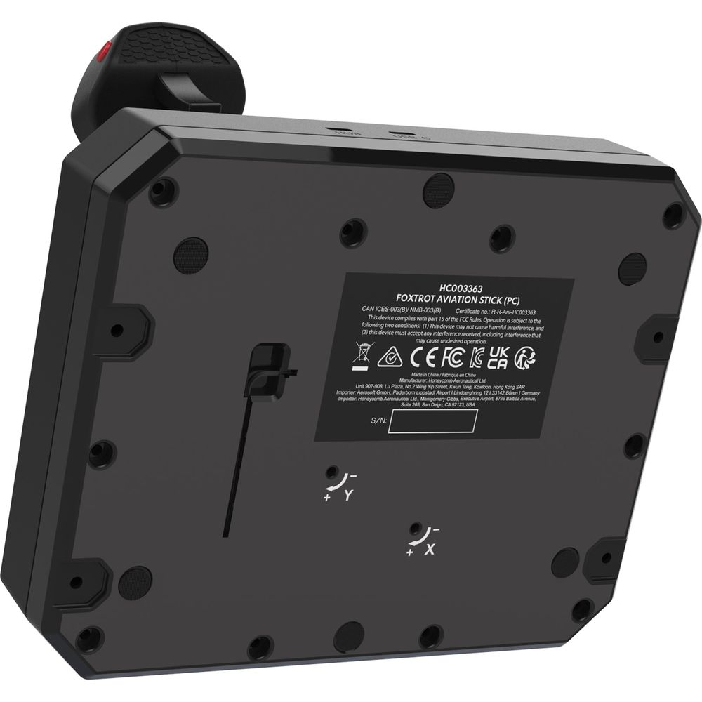 Bottom view of a black flight simulation joystick with label and certification marks.