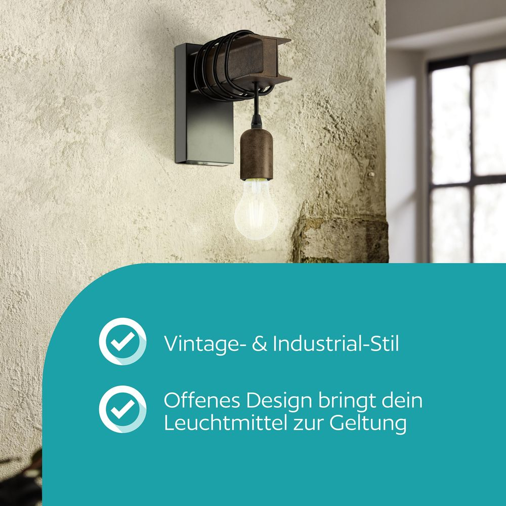 Lámpara de pared industrial vintage con bombilla expuesta y suspensión de cuerda.