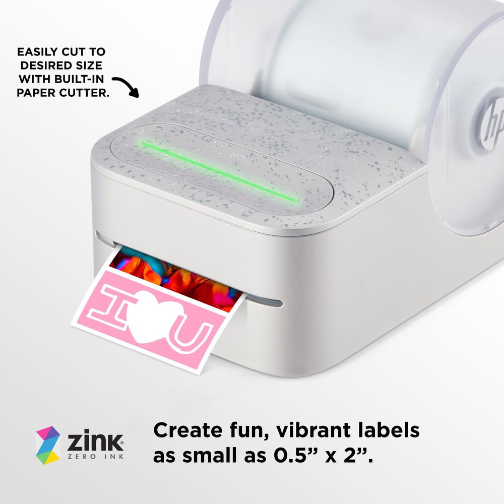 Drukarka drukuje etykietę "I ❤️ U". Podświetlony jest zielony pasek świetlny.