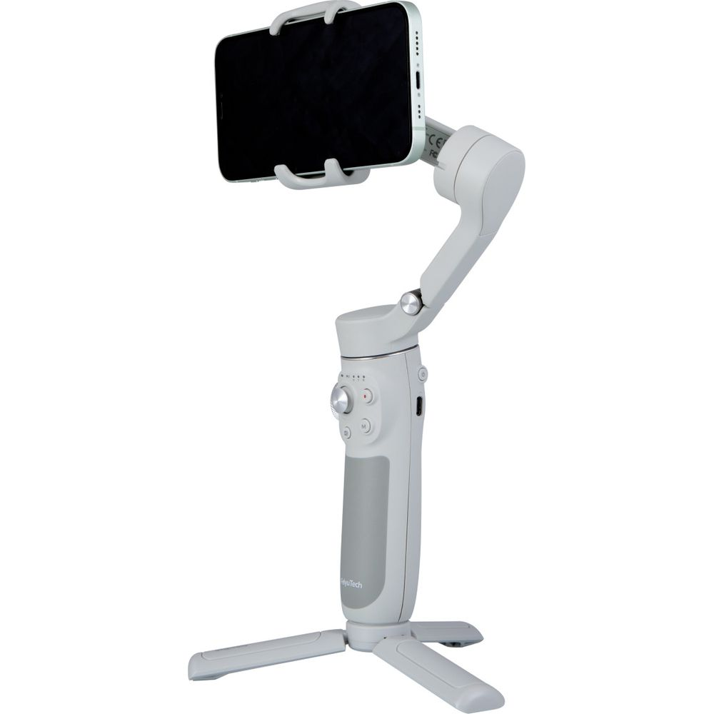 Un cardan gris pour smartphone avec trépied pliable et téléphone monté.