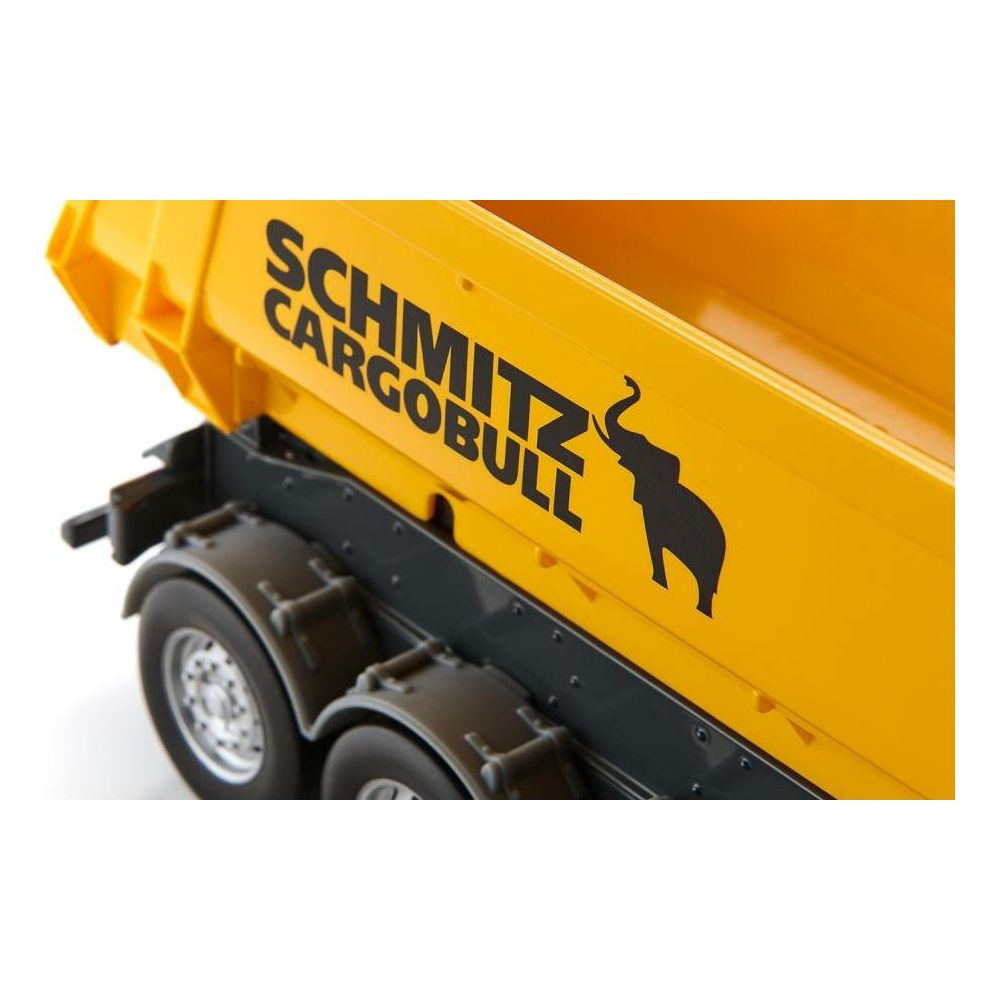 Gelber LKW-Aufbau mit schwarzem Schriftzug 'SCHMITZ CARGOBULL' und Elefantenlogo.