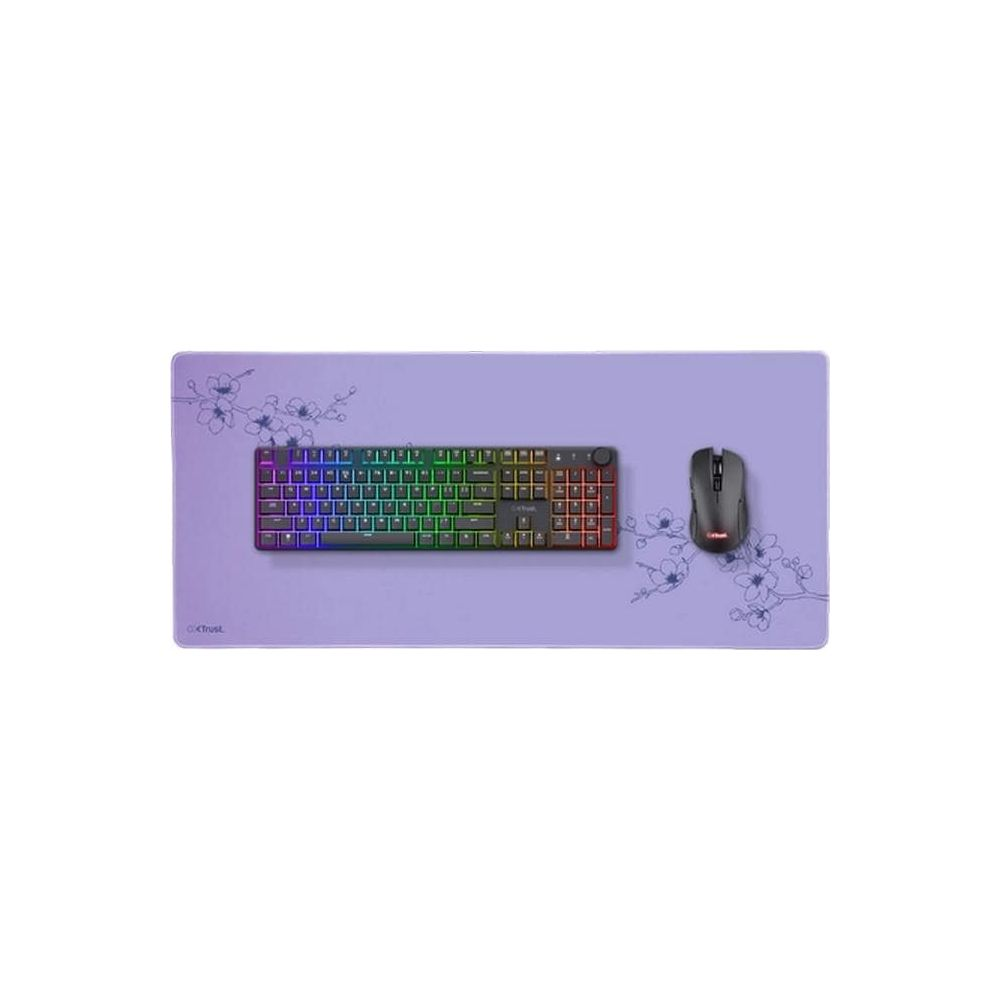 Eine lila Mausmatte mit einer Tastatur und Maus, verziert mit Blumen.