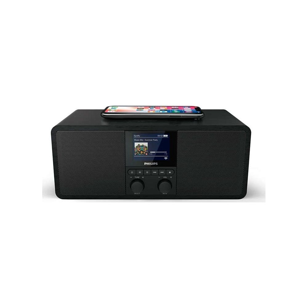 Ein schwarzer Philips Radiowecker mit einem Smartphone auf der Oberseite.