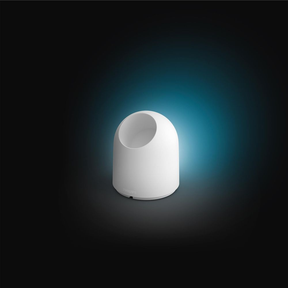Ein weißer, kuppelförmiger Philips Lichtwürfel mit einer Aussparung oben.