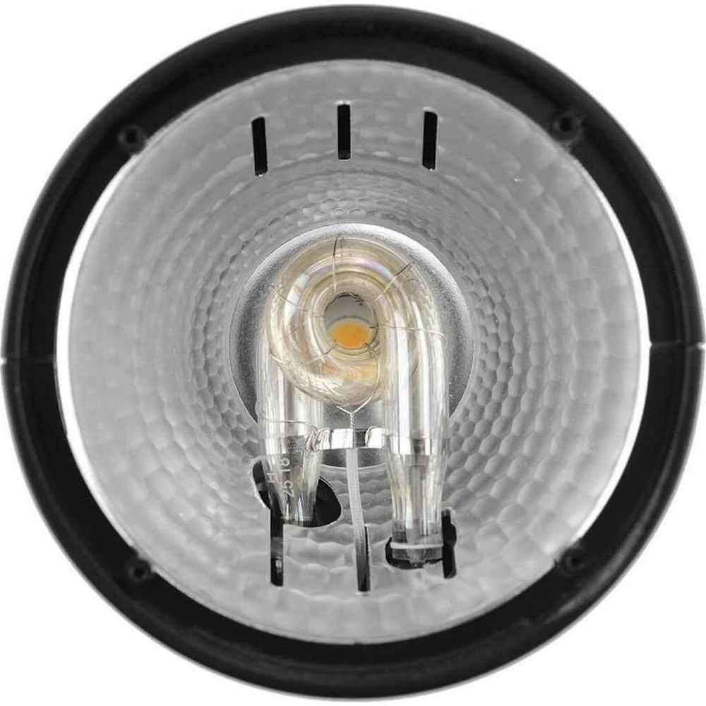 Nahaufnahme einer U-förmigen Glühbirne mit Glühfaden, in einem metallischen Reflektor.