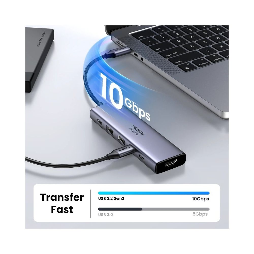 Szara stacja dokująca USB-C podłączona do laptopa, prędkość 10 Gbps.