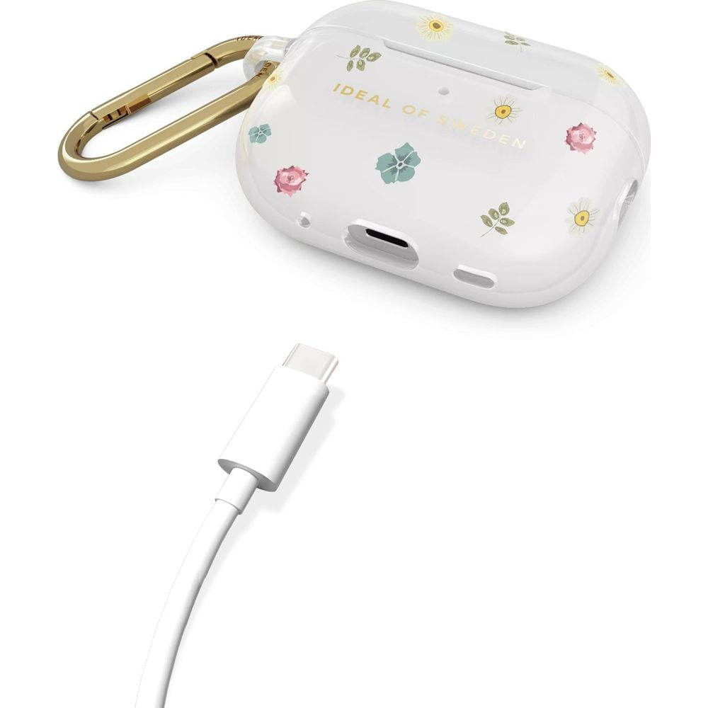 Weiße Ladehülle mit Blumenmuster und goldenem Karabiner, daneben ein weißes Ladekabel.