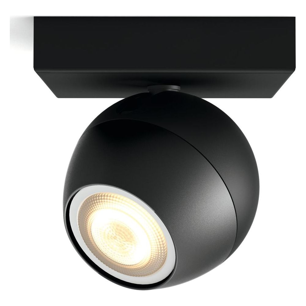 Un faretto da soffitto sferico nero con un anello bianco attorno alla luce.