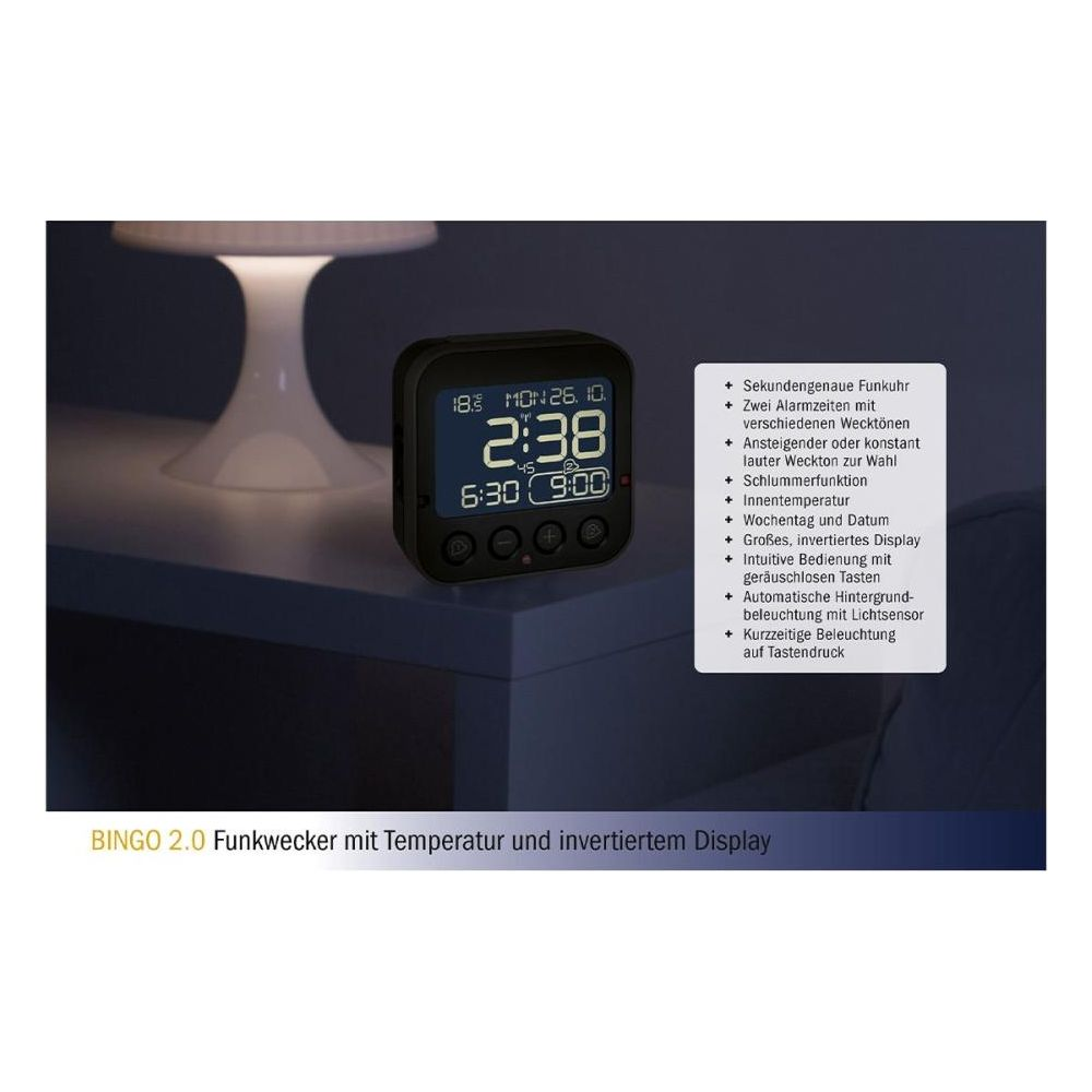 Digitaluhr mit invertiertem Display zeigt Zeit, Datum und Temperatur an.