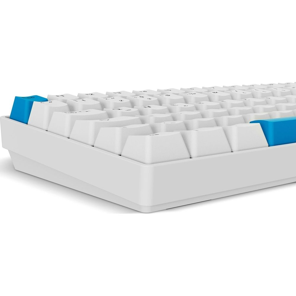 Una tastiera bianca con tasti d'accento blu in primo piano.
