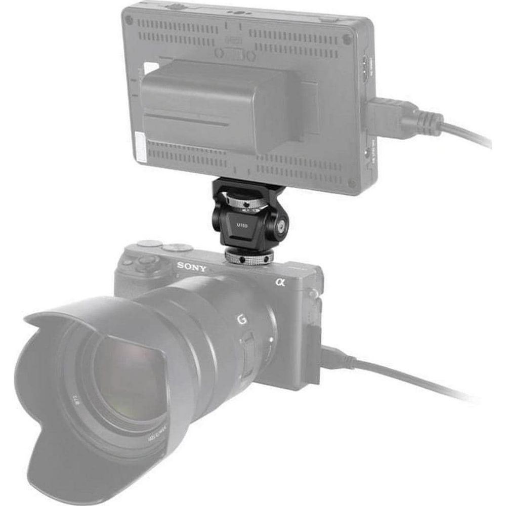 Aparat Sony z uchwytem na monitor, czarny, na białym tle.