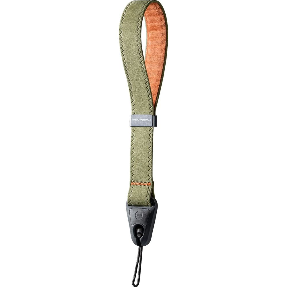 Oliwkowozielona smycz na nadgarstek do aparatu z pomarańczową podszewką i czarną pętlą.