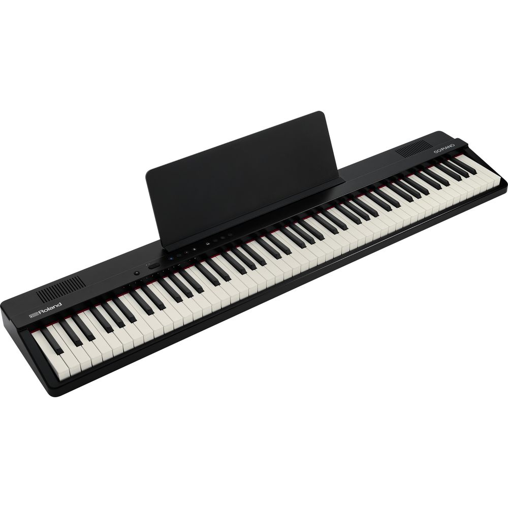 Un piano numérique noir avec un pupitre et des touches blanches et noires.