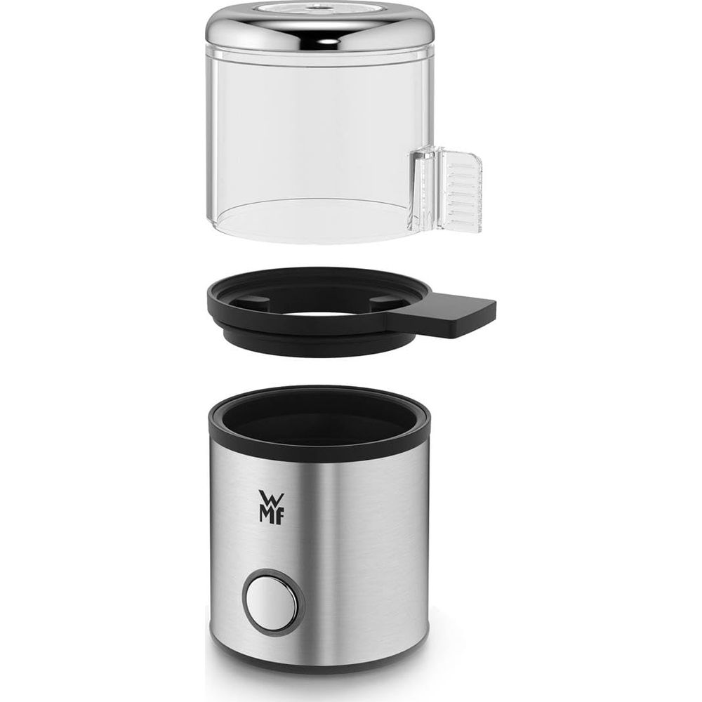Młynek do kawy ze stali nierdzewnej z przezroczystym pojemnikiem, czarnym pierścieniem i srebrną podstawą.