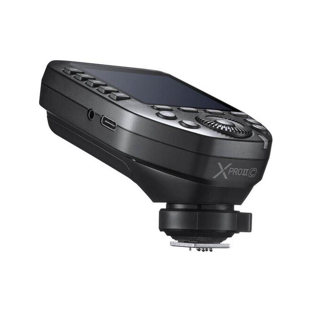 Déclencheur de flash de caméra noir avec écran, port USB et boutons.