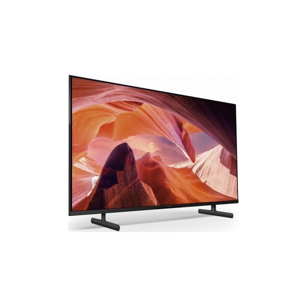 Nowoczesny telewizor z wąską ramką wyświetlający obraz krajobrazu kanionu z księżycem.