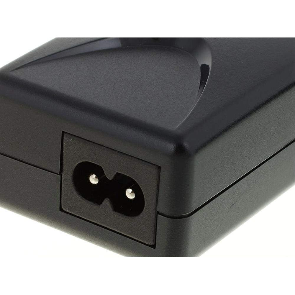 Close-up of a black power adapter socket with two pins.