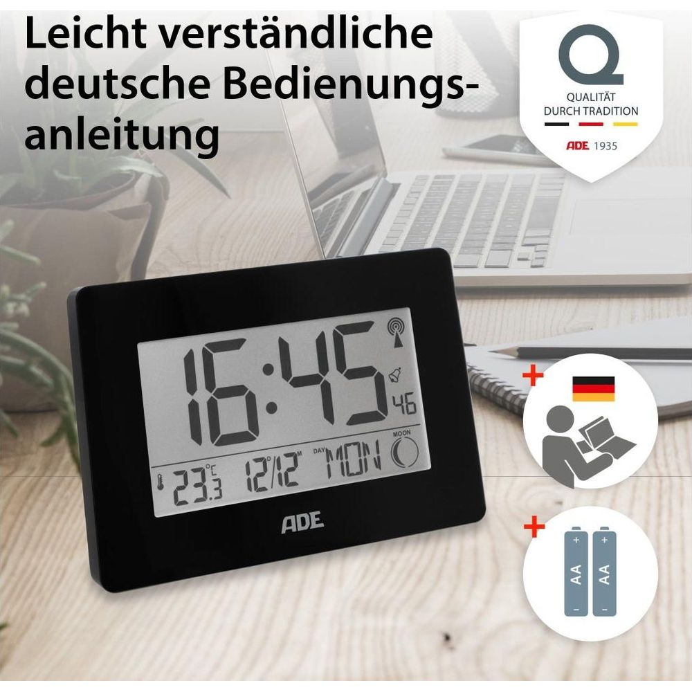 Ein schwarzer Digitalwecker zeigt 16:45 Uhr, Datum und Temperatur an.