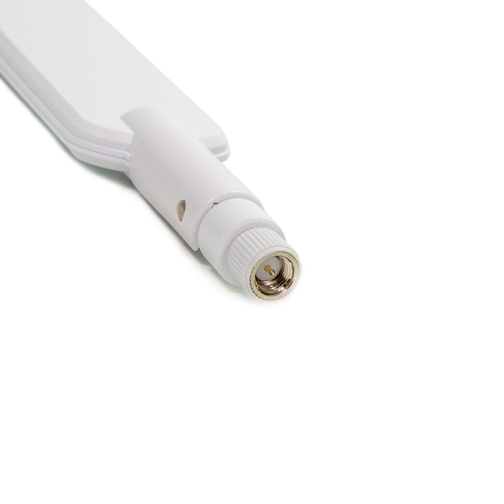 Connettore antenna bianco con filettatura e pin centrale dorato.