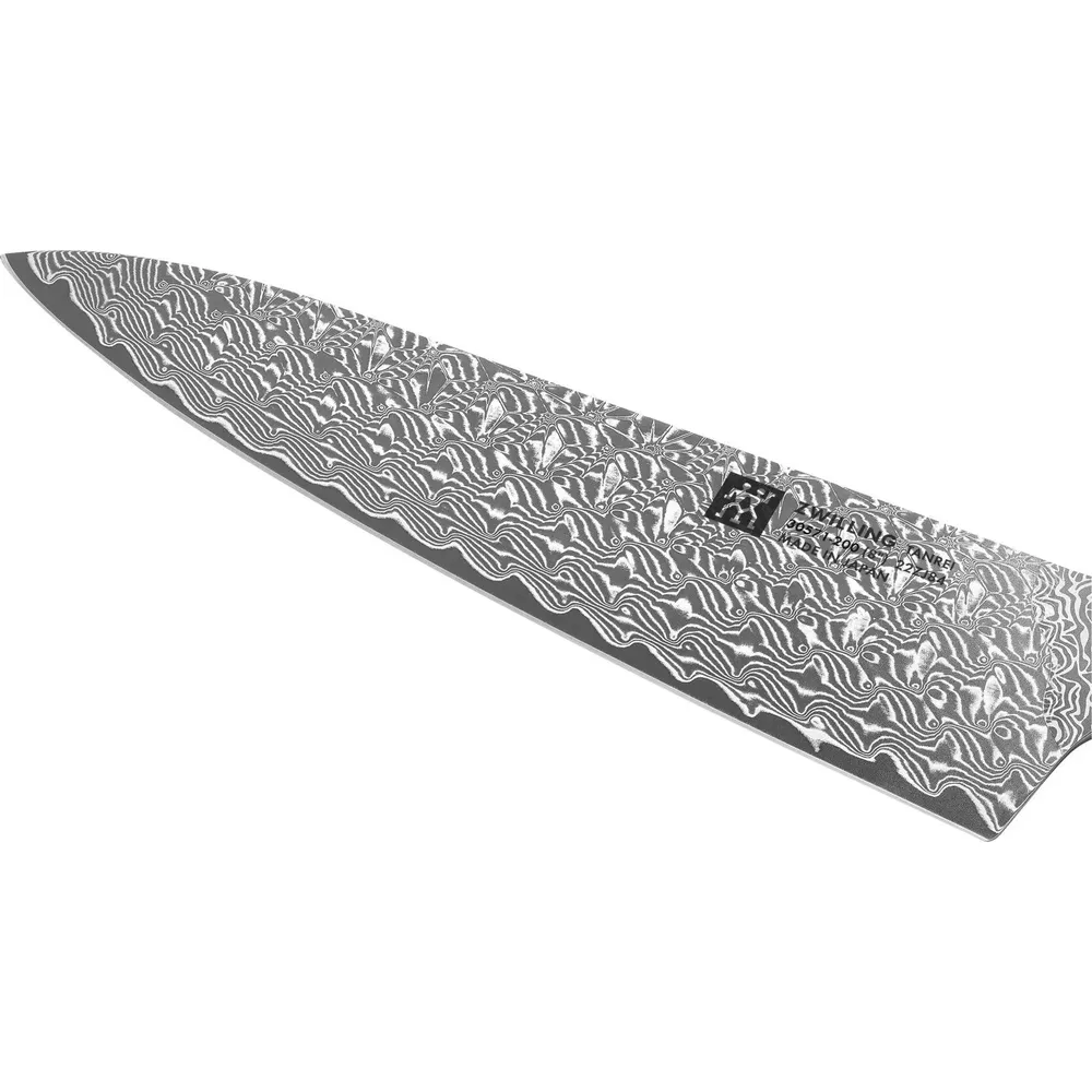 Nóż Damasceński z ostrzem wzorzystym. Ostrze jest w kolorze srebrnym.