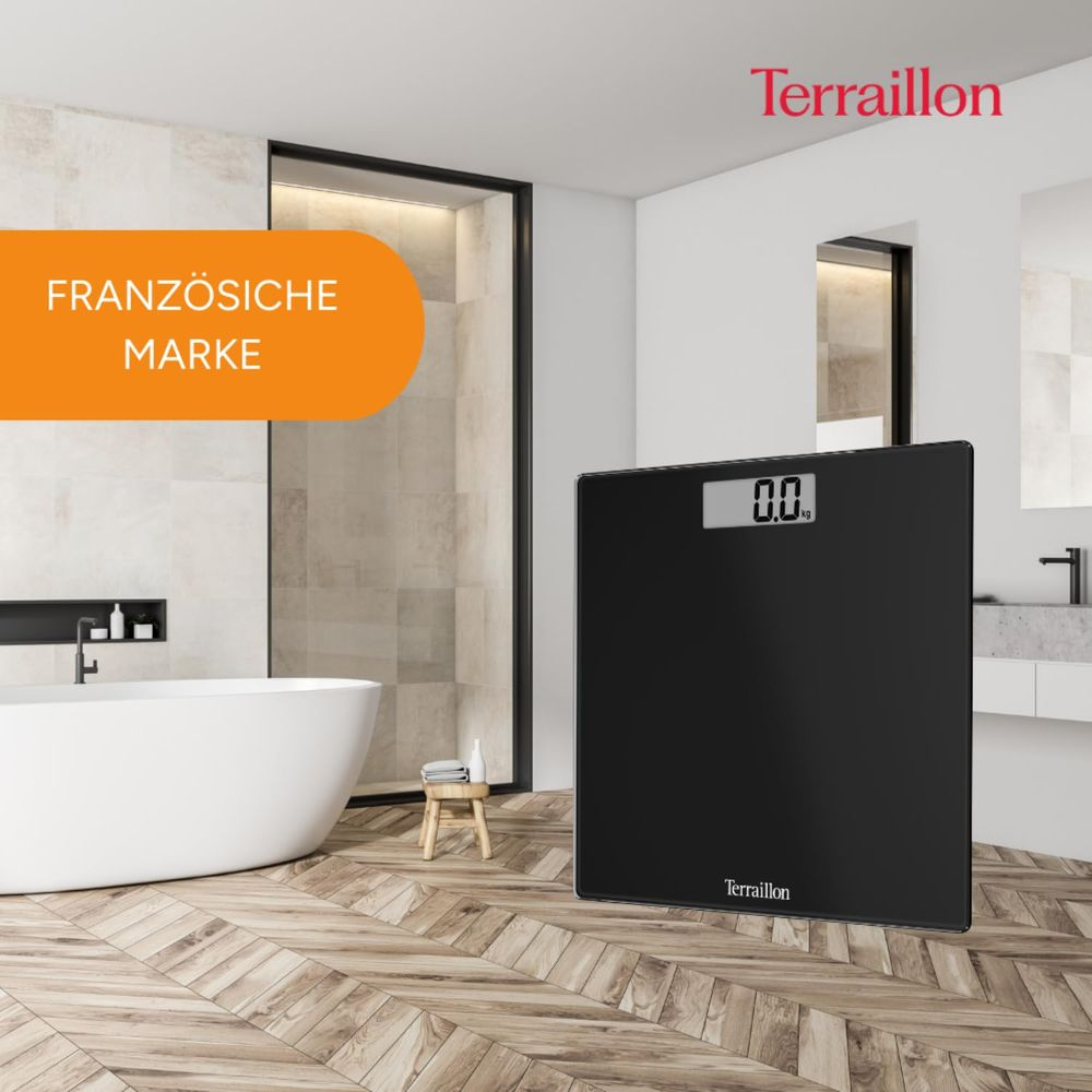Czarna waga cyfrowa z wyświetlonym '0.0 kg', w nowoczesnej łazience.