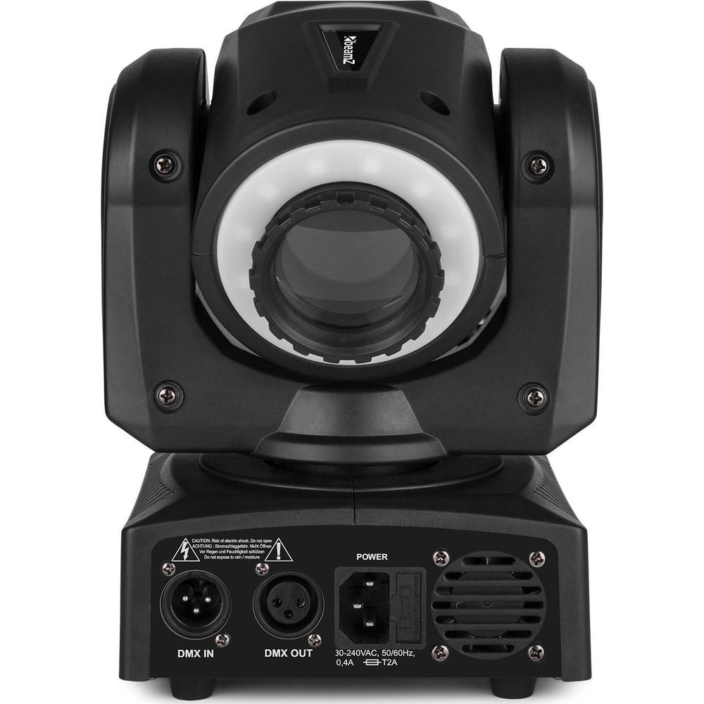 Foco negro con lente, puertos (DMX IN/OUT, Power) y etiquetas de advertencia.