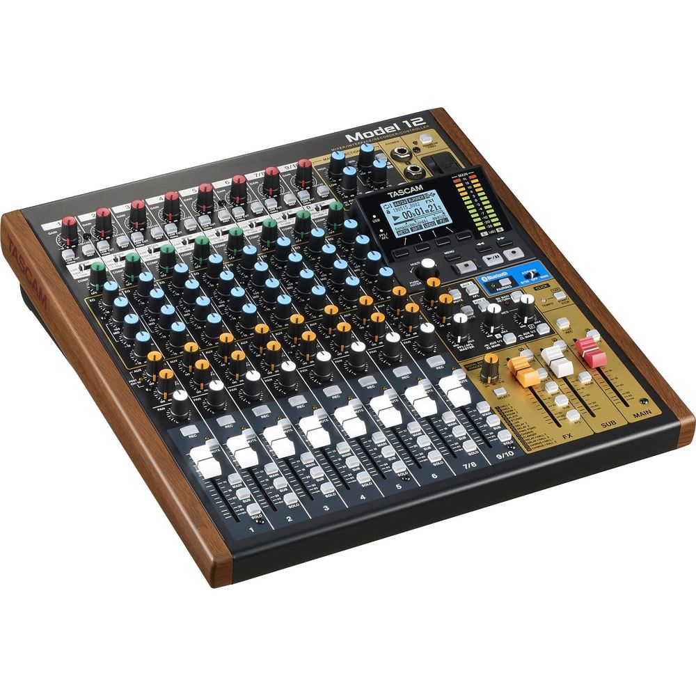 Una console di missaggio Tascam Model 12 con molte manopole, interruttori e un display.