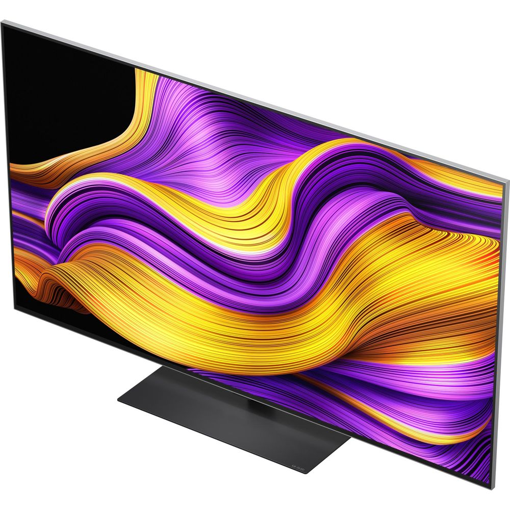 Un téléviseur moderne affichant un motif abstrait et ondulé de violet et de jaune sur son écran.