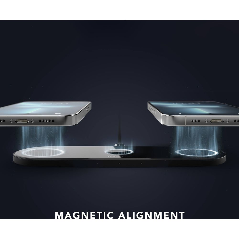 Zwei silberne Smartphones richten sich magnetisch auf ein schwarzes kabelloses Ladepad aus.