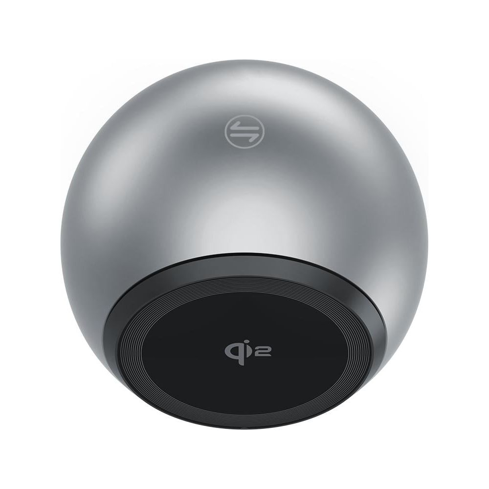Un caricabatterie wireless rotondo argentato con base nera e logo Qi.