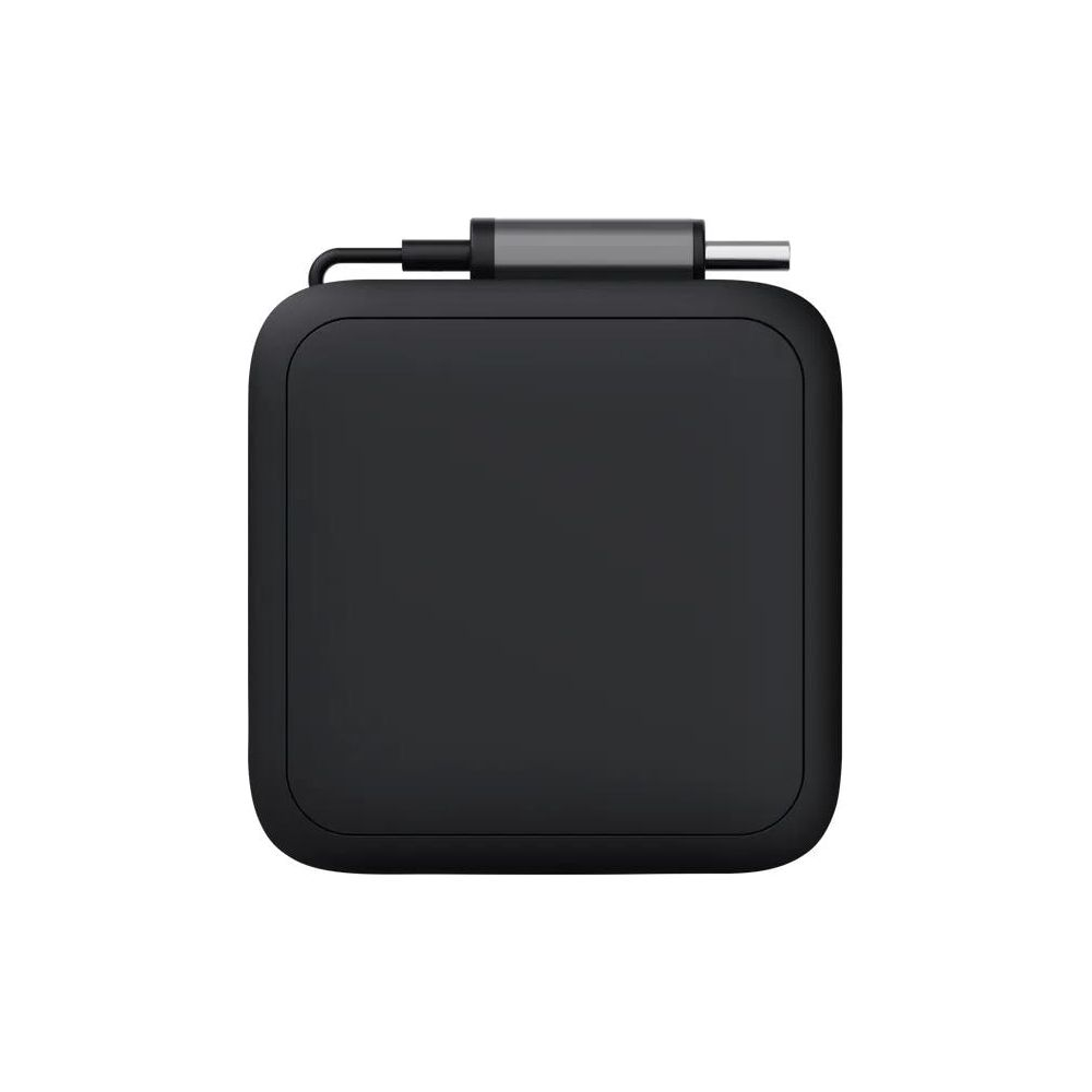A black, rectangular device with rounded corners and a gray plug.