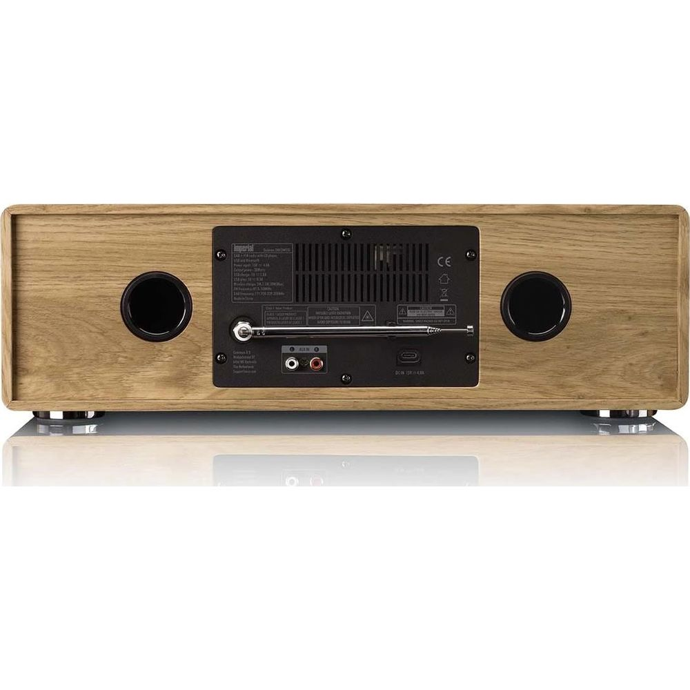 Rückansicht eines Holzradios mit zwei Lautsprechern, Antenne und verschiedenen Anschlüssen.
