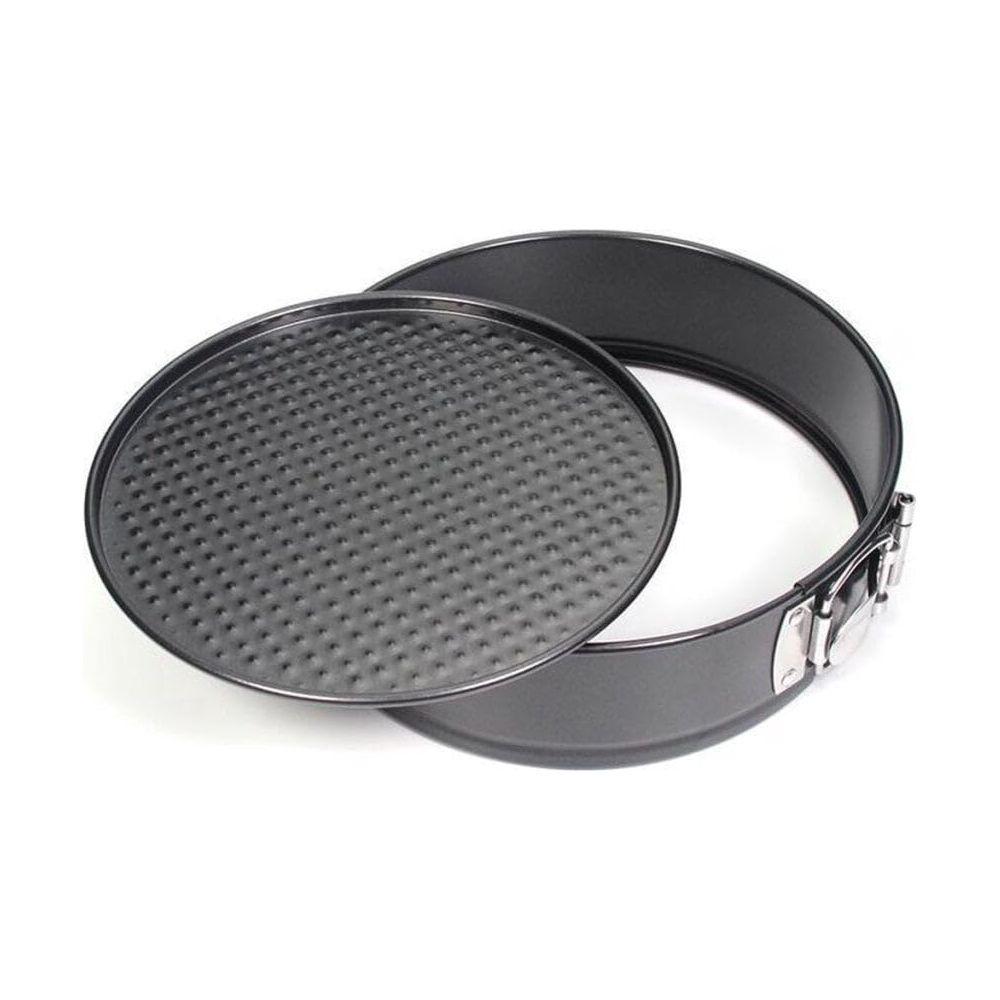 Un moule à manqué rond noir avec fond texturé et fermoir argenté.