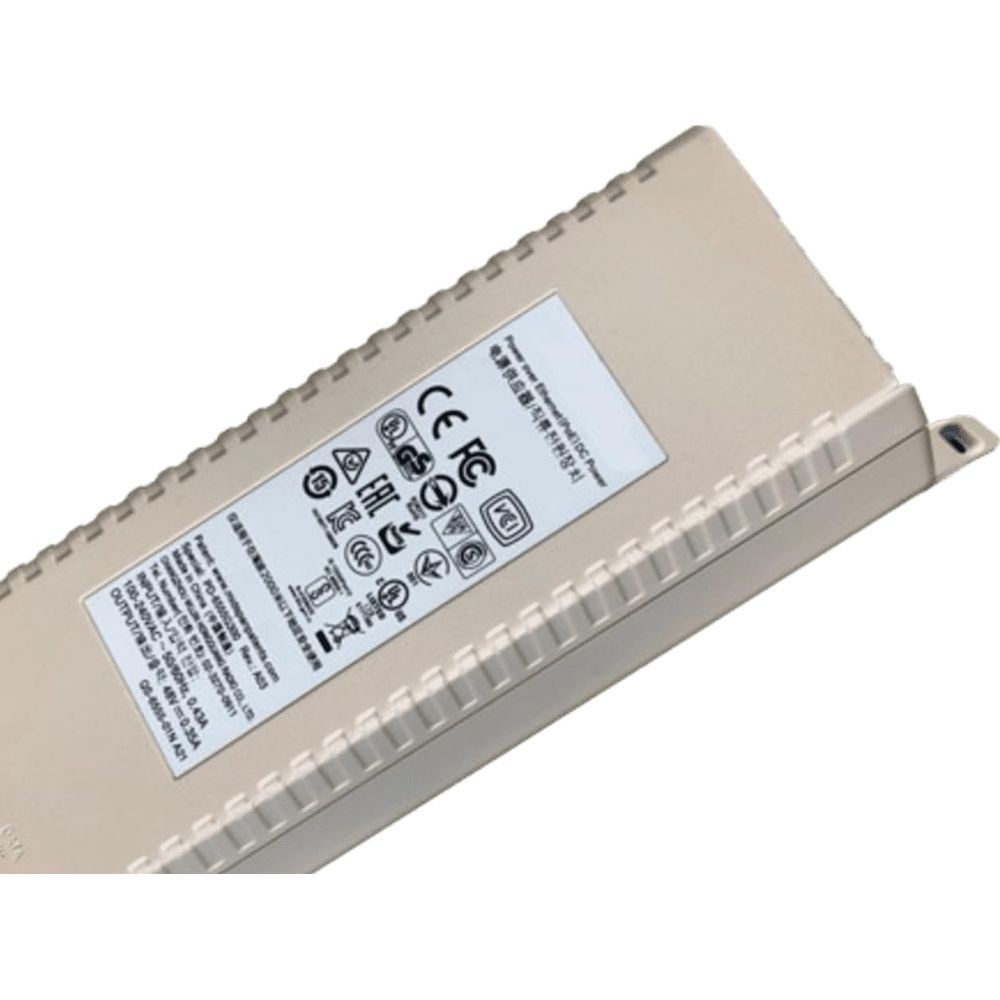 Beige Netzteil mit CE, FCC und anderen Zertifizierungen, mit Details zur Eingangs-/Ausgangsleistung.