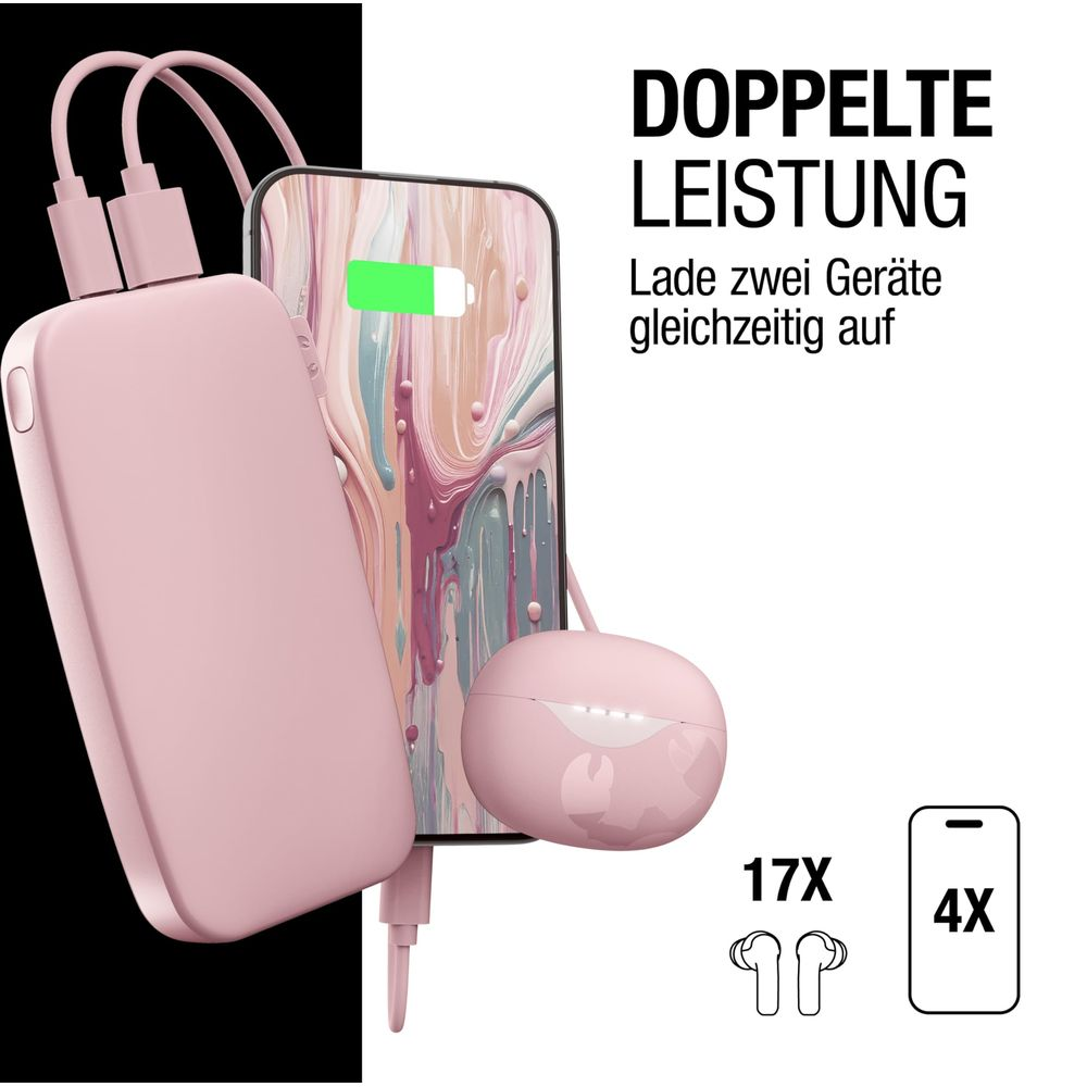 Un power bank rosa carica contemporaneamente uno smartphone e auricolari.