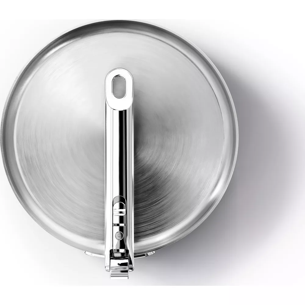 Aşağı doğru bakan bir kulpa ile metal tencere kapağı. Gümüş kaplama.